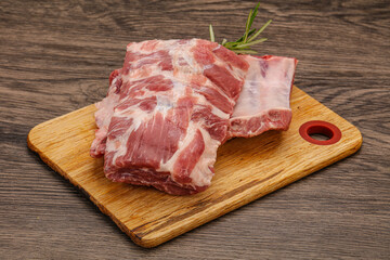 Raw pork ribs served rosemary