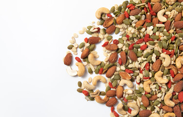 mixed organic cereal and grain seed pile on white background. healthy eating concept. pumpkin,...
