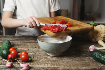 Son preparing healthy food for family dinner. Healthy eating, diet concept. Chef cook at the kitchen.