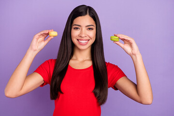 Photo of optimistic millennial brunette hairdo lady hold dessert wear red t-shirt isolated on violet color background