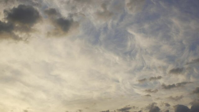 Amazing unusual peaceful early morning sunrise blue sky with soft pastel white fluffy clouds