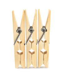 Three classic wooden clothespins on white background