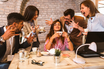 Businesswoman in the office, ignoring work, not listening to annoying clients or bothering colleagues talking to her.