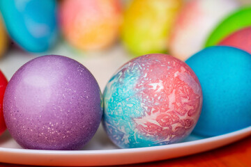 Colored eggs for Easter on a plate 