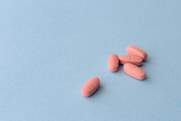 Pharmaceutical medicine pills over blue background