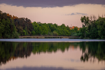 Fototapeta na wymiar The bridge over the Dlugie Lake in Olsztyn at sunset - Warmia and Masuria, Poland, Europe