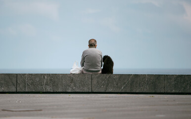 man and his dog resting