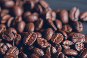 Fresh roasted coffee beans background, Dark tone, Selective focus.