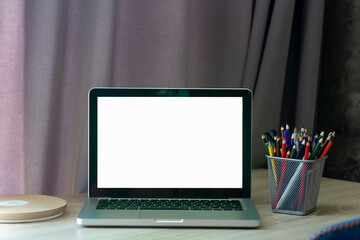 Blank laptop screen. Work or study online from home at a desk and laptop.. 