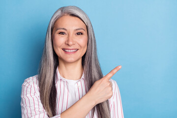 Photo of elderly woman happy positive smile point fingers empty space advert advise suggest...