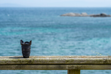 Analog black angle lens on wooden railing