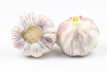 Two large heads of garlic isolated on a white background.