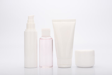 Set of beauty products for daily skin care isolated on white background. Face cream, lotion, mask and scrub on white background. Concept of beauty treatment 