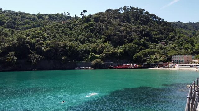 Europe, Italy , Genoa, Santa Margherita Ligure, the amazing beach and sea coast in Paraggi with clear green water during the summer after finish of lockdown due Covid-19 Coronavirus epidemic   