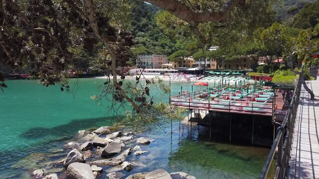 Europe, Italy , Genoa, Santa Margherita Ligure, the amazing beach and sea coast in Paraggi with clear green water during the summer after finish of lockdown due Covid-19 Coronavirus epidemic   
