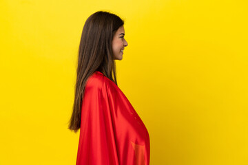 Naklejka premium Super Hero Brazilian woman isolated on yellow background in lateral position