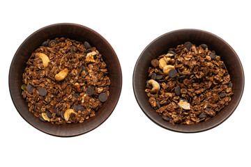 Chocolate granola cereal with nuts in a bowl background.