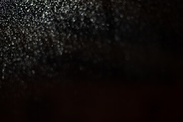 Blurred background with raindrops and lights.