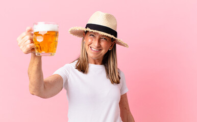 middle age pretty retired woman drinking a beer on holidays