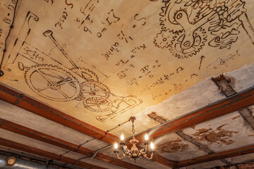 Beautiful grunge ceiling with mathematic formulas and gears resembling Da Vinci drawings in the...