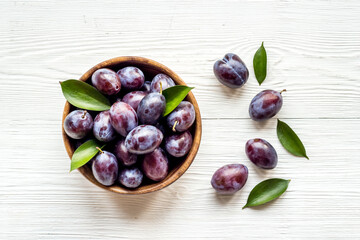 Layout set of ripe purple plums. Top view