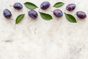 Food pattern - set of purple plums, top view