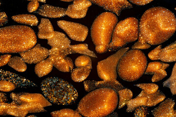macro shot of copper golden insertions in murano black glass