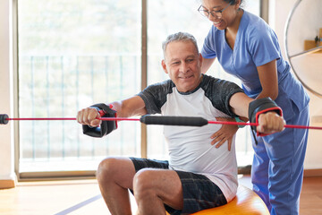 Healthcare: Physiotherapist working on a patient's core 