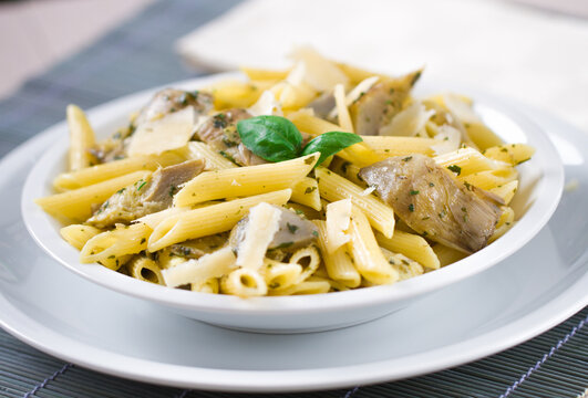 Pasta with Artichokes, Cheese and Herbs. High quality photo.