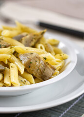 Pasta with Artichokes, Cheese and Herbs. High quality photo.