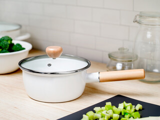 Enamel cooking pot on kitchen countertop