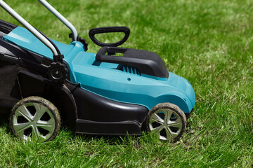 Lawn mower on the grass field