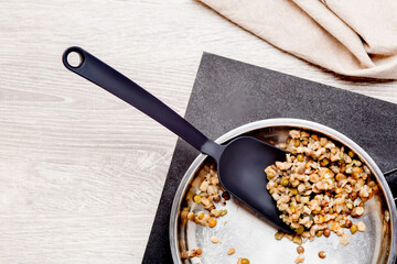 Chef cooking on frying pan