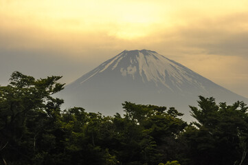 View of Mount Fuji at dusk, from the fumaroles in Mount Hakone, Hakone, Kanagawa Prefecture, Japan. The picture is in landscape view