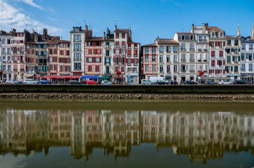 Fototapeta na wymiar Traditional facades with colorful windows in Bayonne, Basque Country, France