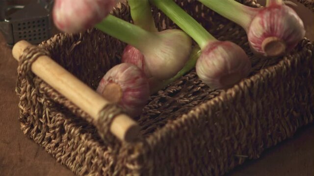 Super slow motion garlic falls into the basket.Filmed on a high-speed camera at 1000 fps. High quality FullHD footage