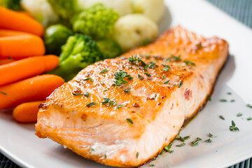 Salmon Fillet with Mixed Steamed Vegetables. High quality photo.