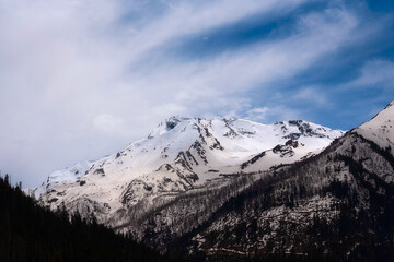 Snow-capped mountain slopes of the Caucasus mountains in early spring