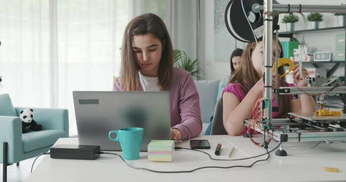 Young girls learning 3D printing at home