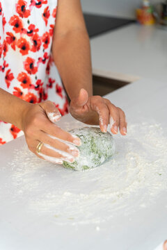 Closeup of hands of Young woman cooking at home