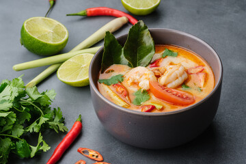 National dish of Laos and Thailand - spicy and sour soup with shrimp Tom Yum. View from above.