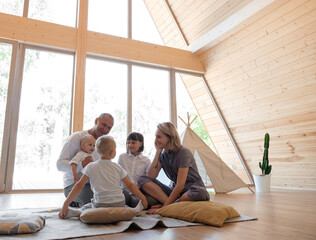 Family talking on floor at home