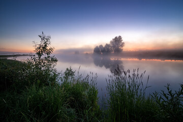 Fototapeta premium morning landscape with fog on the bank of the Ural river, Russia