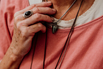 close up senior woman with ethnic accessories