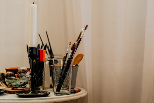 Details of painter studio with paintbrushes