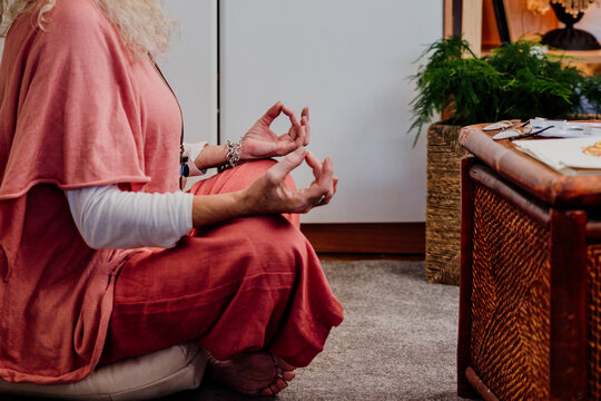 senior woman doing yoga at home
