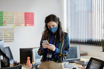 Female big data analyst using mobile phone 