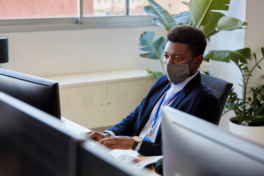 Black businessman working on computer