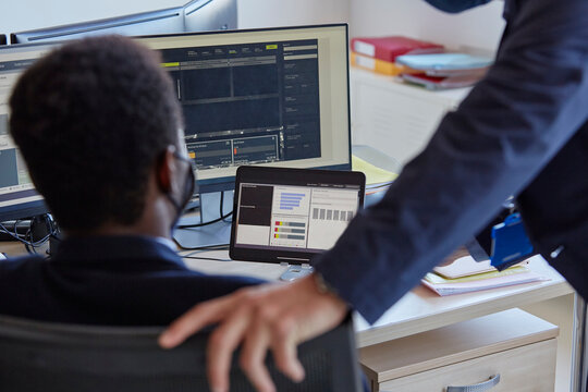 Big data analysts working - Powered by Adobe