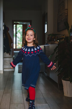 Portrait of a Little Girl in Festive Christmas Dress